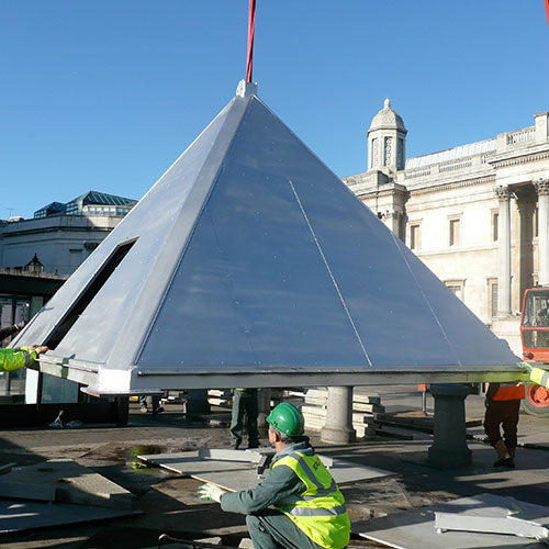 The stainless pyramid base in the square