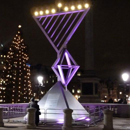 The menorah lit up in the square